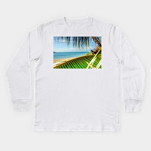 Tropical beach scene with palm fronds. Kids Long Sleeve T-Shirt